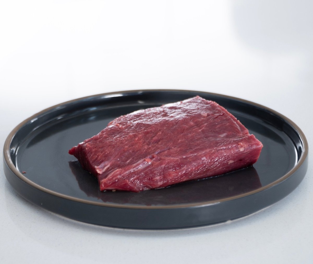 http://capitalfarms.com/cdn/shop/products/flat-iron-steak-8oz-269311.jpg?v=1699141435